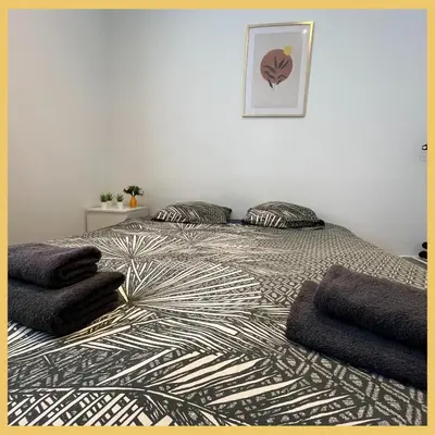 Un ou plusieurs lits dans un hébergement de l'établissement Appartement St Genis Laval Hyper centre