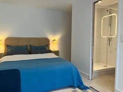 Un ou plusieurs lits dans un hébergement de l'établissement Studio neuf dans un écrin de verdure