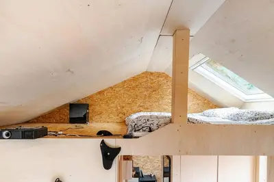 Un ou plusieurs lits dans un hébergement de l'établissement Cocon nature, clim & home cinéma