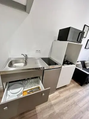 Cuisine ou kitchenette dans l'établissement Appartement proche centre