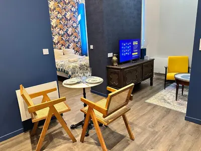Coin salon dans l'établissement Craft Home - Le tapissier - Balneo - Parking privé