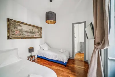 Un ou plusieurs lits dans un hébergement de l'établissement Appartement 100m2 d'élégance au sein d'un Château caché à 10min de Lyon