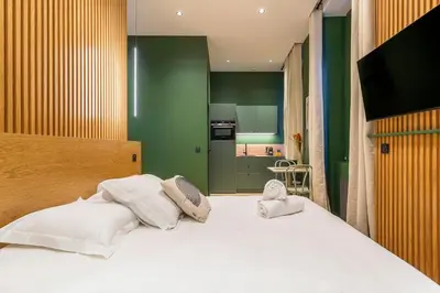 Un ou plusieurs lits dans un hébergement de l'établissement L'Exclusif Spa Suites Prestige Lyon Croix-Rousse