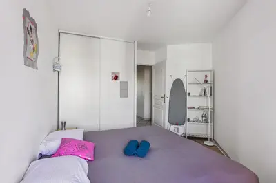 Un ou plusieurs lits dans un hébergement de l'établissement Superbe T3 Villeurbanne Centre avec climatisation