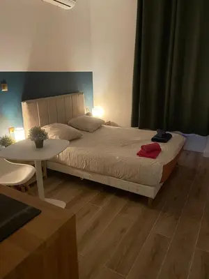 Un ou plusieurs lits dans un hébergement de l'établissement CHARMANT STUDIO à MONTCHAT