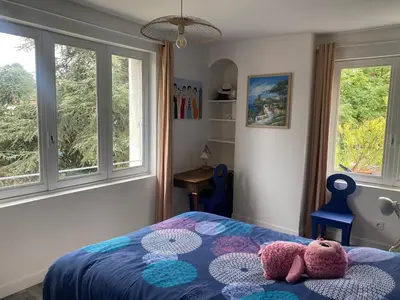 Un ou plusieurs lits dans un hébergement de l'établissement Chambre dans villa les terrasses