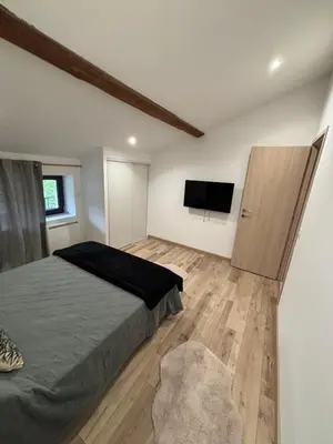 Un ou plusieurs lits dans un hébergement de l'établissement Appartement moderne rénové et tout équipé