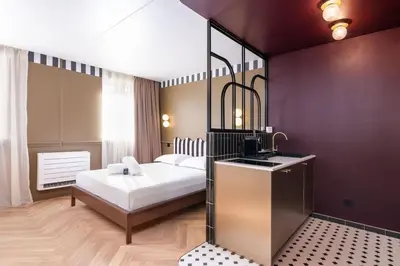 Un ou plusieurs lits dans un hébergement de l'établissement Studio Art Déco Escapade Élégante et Raffinée