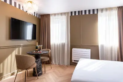 Un ou plusieurs lits dans un hébergement de l'établissement Studio Art Déco Escapade Élégante et Raffinée