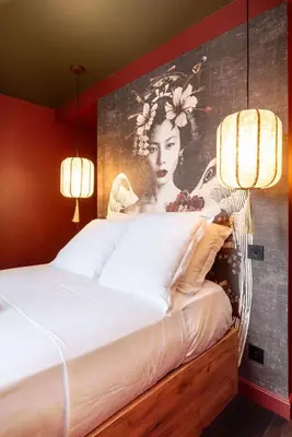 Un ou plusieurs lits dans un hébergement de l'établissement Geisha Studio design, romantisme et parking