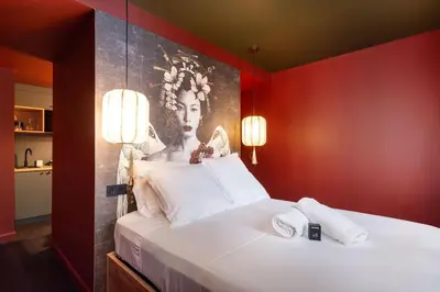 Un ou plusieurs lits dans un hébergement de l'établissement Geisha Studio design, romantisme et parking
