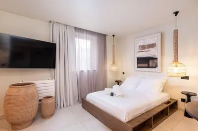Un ou plusieurs lits dans un hébergement de l'établissement Jardin Secret - Love Room avec Balnéo
