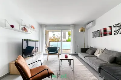 Coin salon dans l'établissement Large family apartment with parking in Lyon