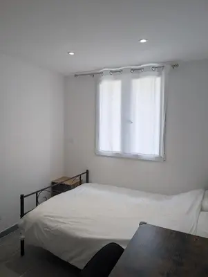 Un ou plusieurs lits dans un hébergement de l'établissement Appartement joli proche de Lyon