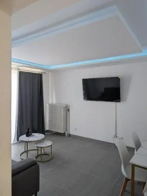 Télévision ou salle de divertissement dans l'établissement Appartement joli proche de Lyon