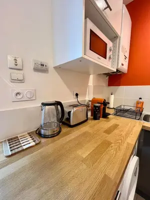 Cuisine ou kitchenette dans l'établissement T2 Confort & Design avec Jardin - Gare d'Oullins