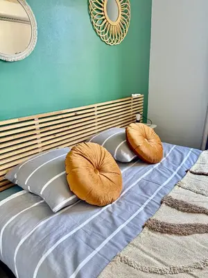 Un ou plusieurs lits dans un hébergement de l'établissement Art de Recevoir - Douce Escapade à Lyon 8 - Appartement Lumineux avec Terrasse & Climatisation
