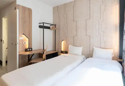 Un ou plusieurs lits dans un hébergement de l'établissement B&B HOTEL Lyon Ouest Tassin