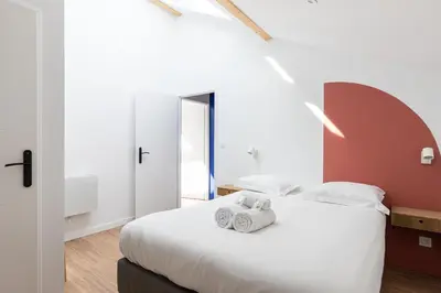 Un ou plusieurs lits dans un hébergement de l'établissement Zest Terracotta Villeurbanne