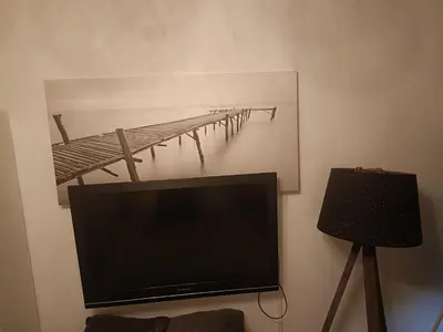 Télévision ou salle de divertissement dans l'établissement Chambre d hôte chez l habitant