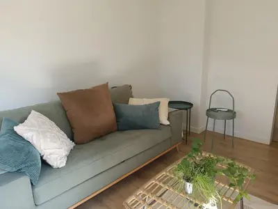 Coin salon dans l'établissement La P'tite Dombes - Entre Terres et Sommets