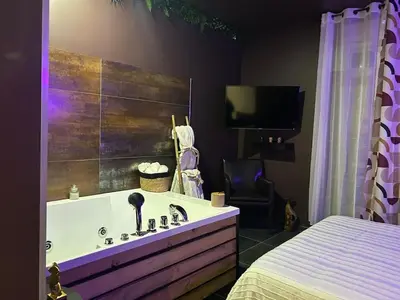Un ou plusieurs lits dans un hébergement de l'établissement Appartement Romantique Exceptionnel