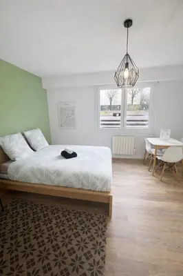 Un ou plusieurs lits dans un hébergement de l'établissement Escapade Lyonnaise - Studio proche Gare & Doua