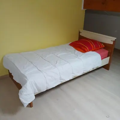 Un ou plusieurs lits dans un hébergement de l'établissement Maison spacieuse de 3 chambres, à proximité de la Centrale du Bugey