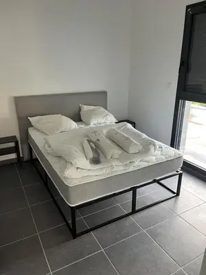 Un ou plusieurs lits dans un hébergement de l'établissement Ampuis centre - Appartement indépendant