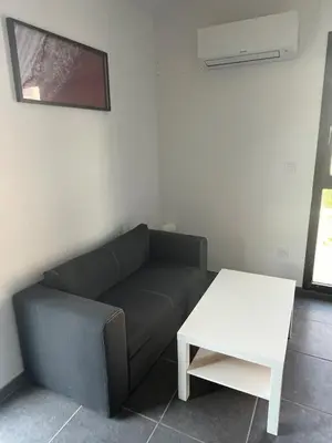 Coin salon dans l'établissement Ampuis centre - Appartement indépendant