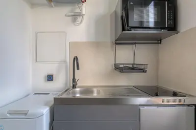 Cuisine ou kitchenette dans l'établissement Cosy et Atypique duplex 5min métro Gare Oullins