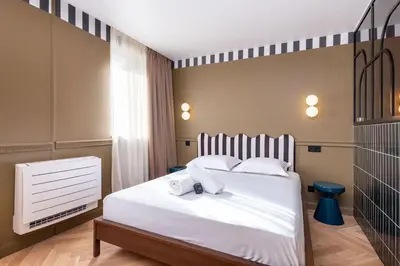 Un ou plusieurs lits dans un hébergement de l'établissement Studio Élégant-Une Escapade Raffinée en Plein Cœur de la Ville