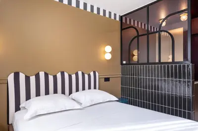 Un ou plusieurs lits dans un hébergement de l'établissement Studio Élégant-Une Escapade Raffinée en Plein Cœur de la Ville