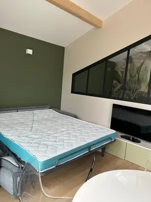 Un ou plusieurs lits dans un hébergement de l'établissement Logement climatisé, piscine, 4 personnes