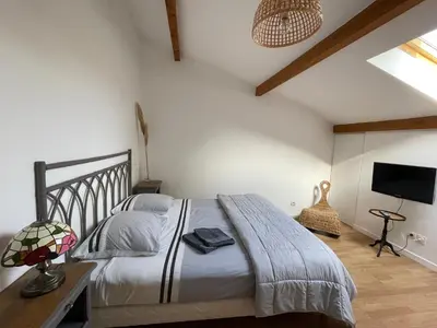 Un ou plusieurs lits dans un hébergement de l'établissement La Sereine - Appartement 2 chambres pour 4 personnes