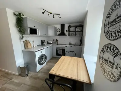 Cuisine ou kitchenette dans l'établissement La Sereine - Appartement 2 chambres pour 4 personnes