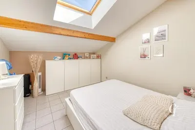 Un ou plusieurs lits dans un hébergement de l'établissement Laura - Cozy appartement, confort à Béligneux - Idéal PROS