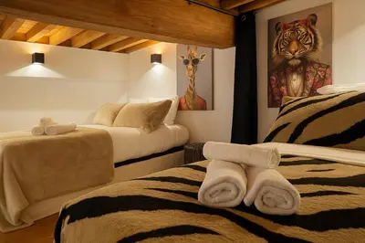 Un ou plusieurs lits dans un hébergement de l'établissement Esprit Loft 8 personnes Hyper-Centre