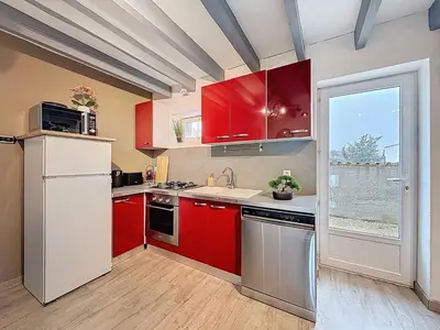 Cuisine ou kitchenette dans l'établissement Maison de la Roche