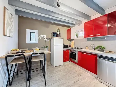 Cuisine ou kitchenette dans l'établissement Maison de la Roche