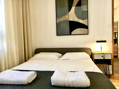 Un ou plusieurs lits dans un hébergement de l'établissement Premium Comfort-2 Suites-Part-Dieu-Parking-Netflix