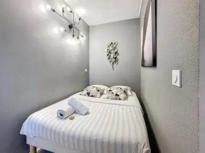 Un ou plusieurs lits dans un hébergement de l'établissement Le Studio Cosy Partdieu Villette