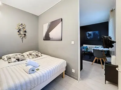Un ou plusieurs lits dans un hébergement de l'établissement Le Studio Cosy Partdieu Villette