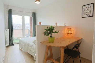 Un ou plusieurs lits dans un hébergement de l'établissement Séjour lumineux T3 moderne, balcon & ascenseur