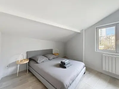 Un ou plusieurs lits dans un hébergement de l'établissement Appartement confortable Oullins centre