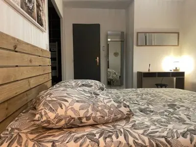Un ou plusieurs lits dans un hébergement de l'établissement Le Cosy Five maison moderne