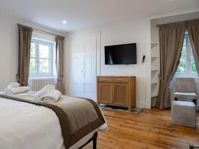 Un ou plusieurs lits dans un hébergement de l'établissement Appartements du Château GrandClément, entre Histoire & Modernité Cœur Métropole