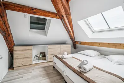 Un ou plusieurs lits dans un hébergement de l'établissement Appartements du Château GrandClément, entre Histoire & Modernité Cœur Métropole