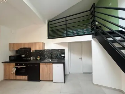Cuisine ou kitchenette dans l'établissement La Vie est Belle