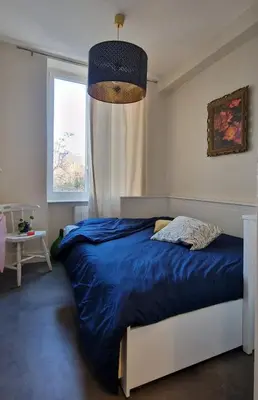 Un ou plusieurs lits dans un hébergement de l'établissement Charmant studio privatif au coeur de Lyon